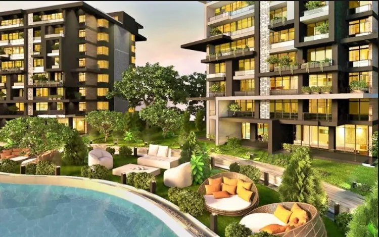 مشروع لا كابيتال العاصمة الإدارية صورة توضح إطلالة الوحدات السكنية على المساحات الخضراء وحمامات السباحة في كمبوند لا كابيتال العاصمة الادارية
